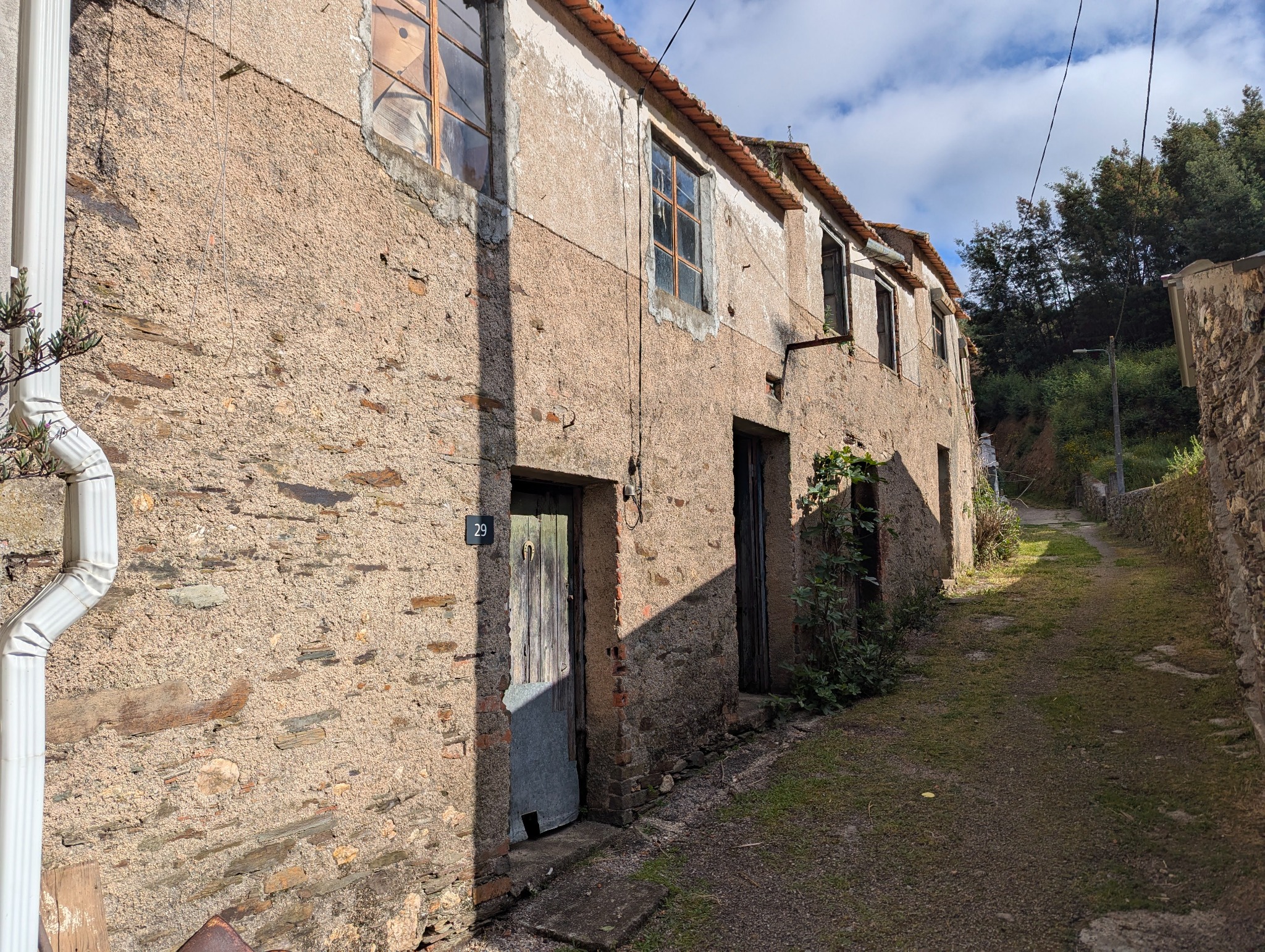 Front of the three adjoining village ruins
